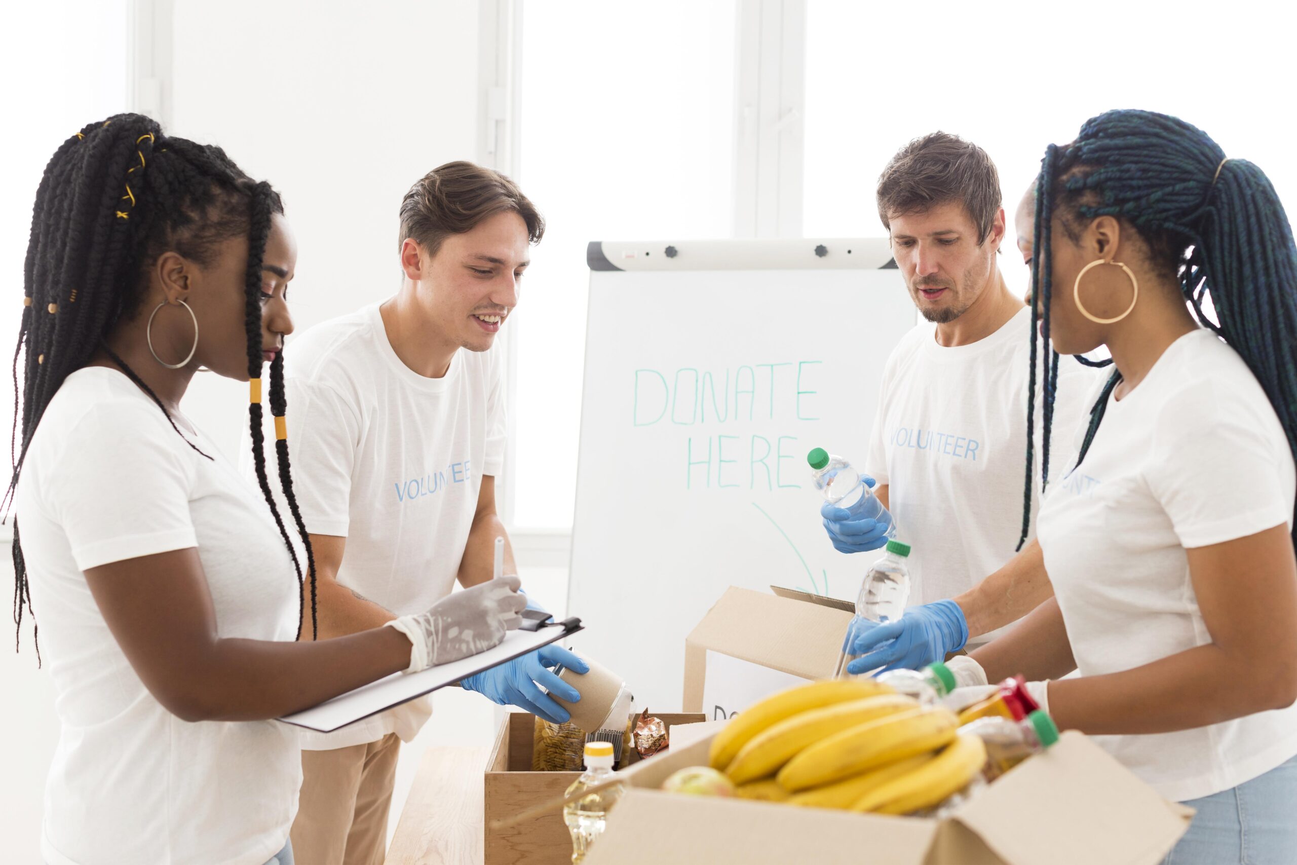 front-view-people-taking-care-donations-together front-view-people-taking-care-donations-together